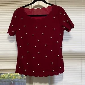 Blouse with scallop neckline & pearl embellishments.
